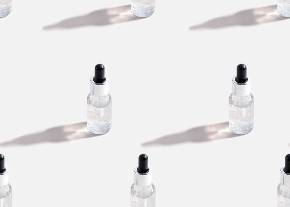 胶原蛋白白底玻璃瓶中的Seamlee图案精华液隔离护肤油水疗护理油