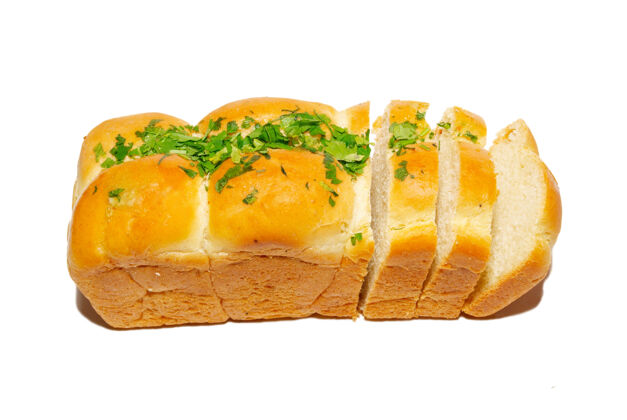 整个金黄色的新鲜面包 绿色和白色分开烘焙新鲜小麦