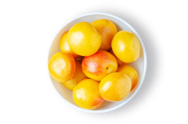 盘子油桃白色盘子里的成熟浆果白色隔离水果杏子甜点