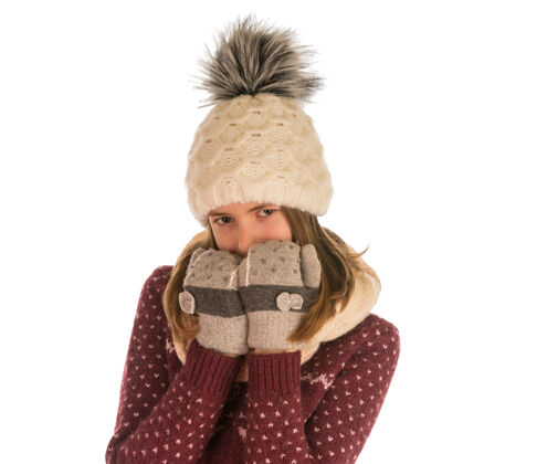 帽子可爱的女孩在温暖的毛衣 帽子 围巾和手套覆盖她的脸上孤立的白色有趣金发女士
