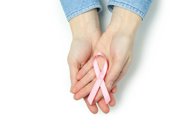 护理女性手上拿着粉色的意识丝带 孤立在白色上癌症医学顶视图