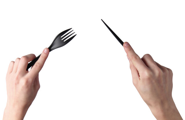 单女性手拿黑色塑料刀 叉子隔离在白色表面叉子设备人