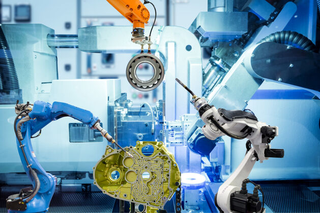 技术工业自动化机器人在机器蓝色墙壁上的智能工厂与汽车零件一起工作钢铁工程钢铁