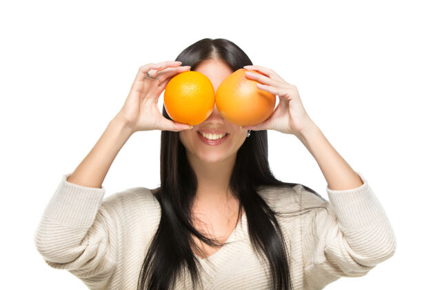 水果穿橘色衣服的年轻漂亮女人味道食物脸