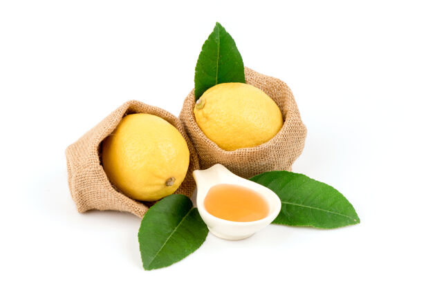 蔬菜柠檬水果和蜂蜜隔离在白色食品香料配料