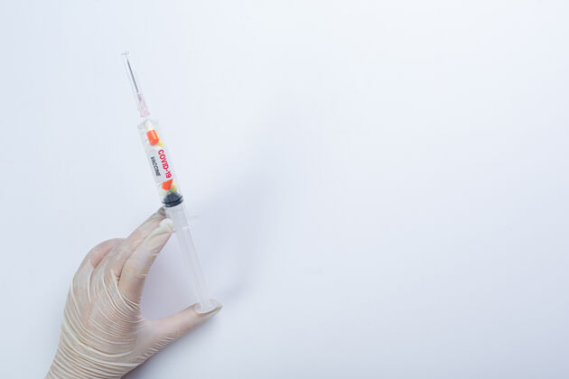 试管在一个研究性的医学实验室里用柯维德-19疫苗安瓿大流行面罩医疗保健