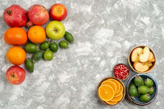 醇香俯瞰不同的水果橙子飞珠橘子和苹果在白色的背景上醇厚成熟的新鲜水果不同生的水果