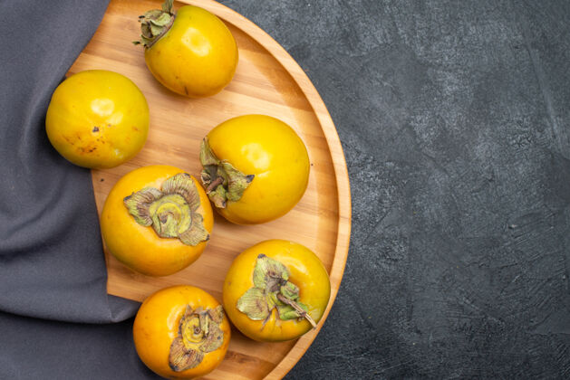 健康顶视图新鲜柿子熟了甜甜的水果 上桌深色水果成熟醇厚食物黄色有机