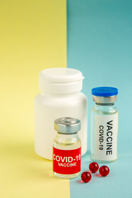 背景前视图疫苗黄蓝色背景大流行色健康疫苗药物病毒医院科学容器医学玻璃