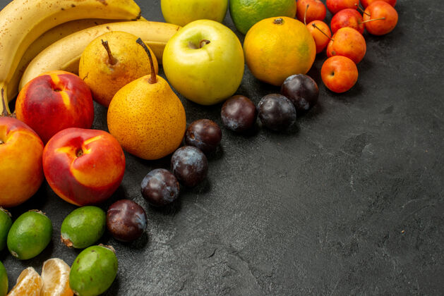 柑橘前视水果组成新鲜水果灰桌上熟透新鲜多色醇香食品多汁减肥