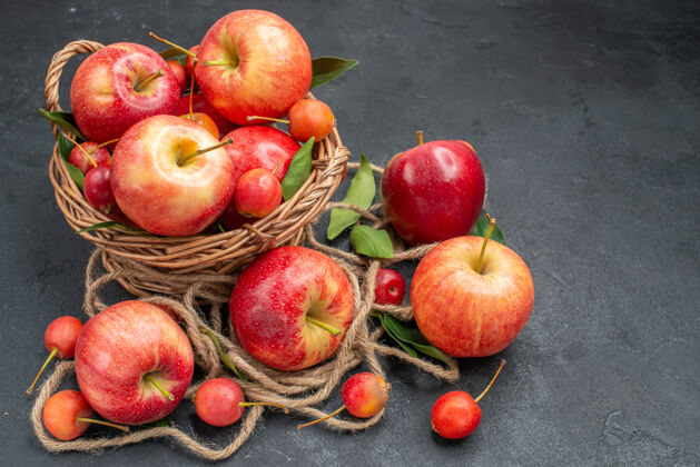 桃子侧视图水果苹果樱桃在篮子旁边的水果和绳子食物苹果健康
