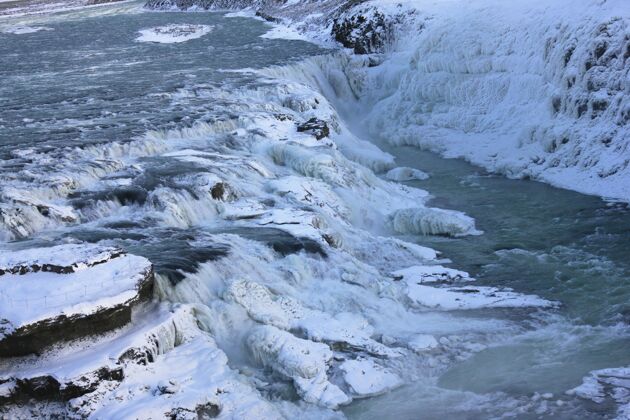 融化冰岛的格尔福斯瀑布 欧洲冰雪环绕树斯堪的纳维亚半岛雨