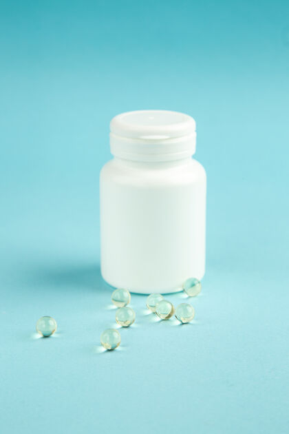 正面前视图白色塑料罐与蓝色背景上的药丸药品容器健康