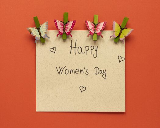 水平妇女节卡片顶视图 带纸蝴蝶和服装别针女权主义平等平面图