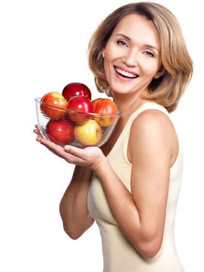 年轻一个拿着苹果的年轻女人的肖像-孤立在白色上食物持有皮肤