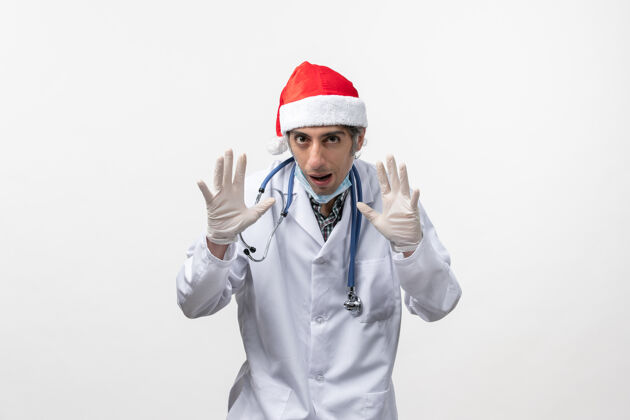 冠状病毒正面图戴着手套的男医生白墙病毒假日病毒-情感手套圣诞节医生