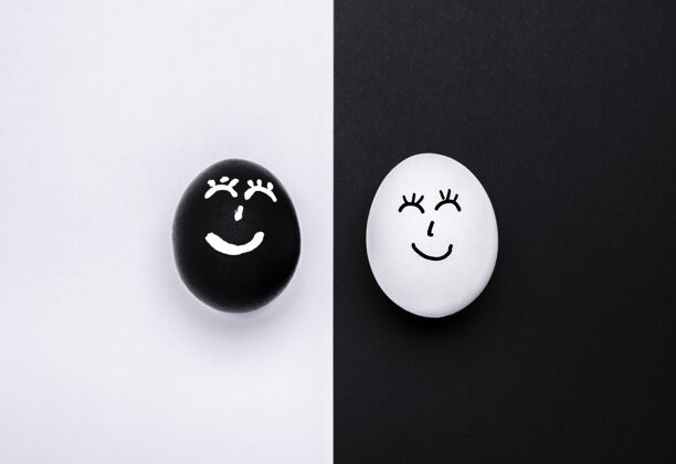 运动两个不同颜色的蛋的俯视图 它们的脸代表着黑色生命物质的运动压制黑人平面