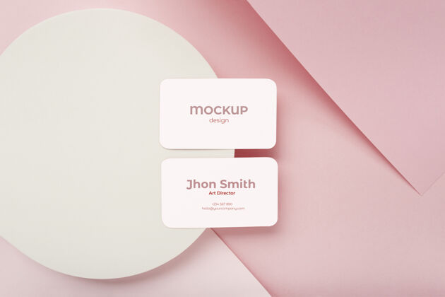 公司极简主义的名片模型上的粉红色和白色的几何背景组成品牌优雅名片